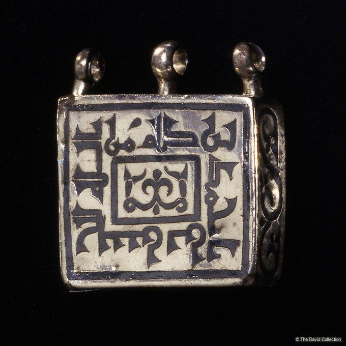 This square amulet case, inscribed with the Kufi script, features a blessing for its owner, Hasan ibn Ahmad. With simple vegetal decorations, its design invites the storage of an invocation or verse inside. A testament to faith. | bit.ly/3GXpmaI