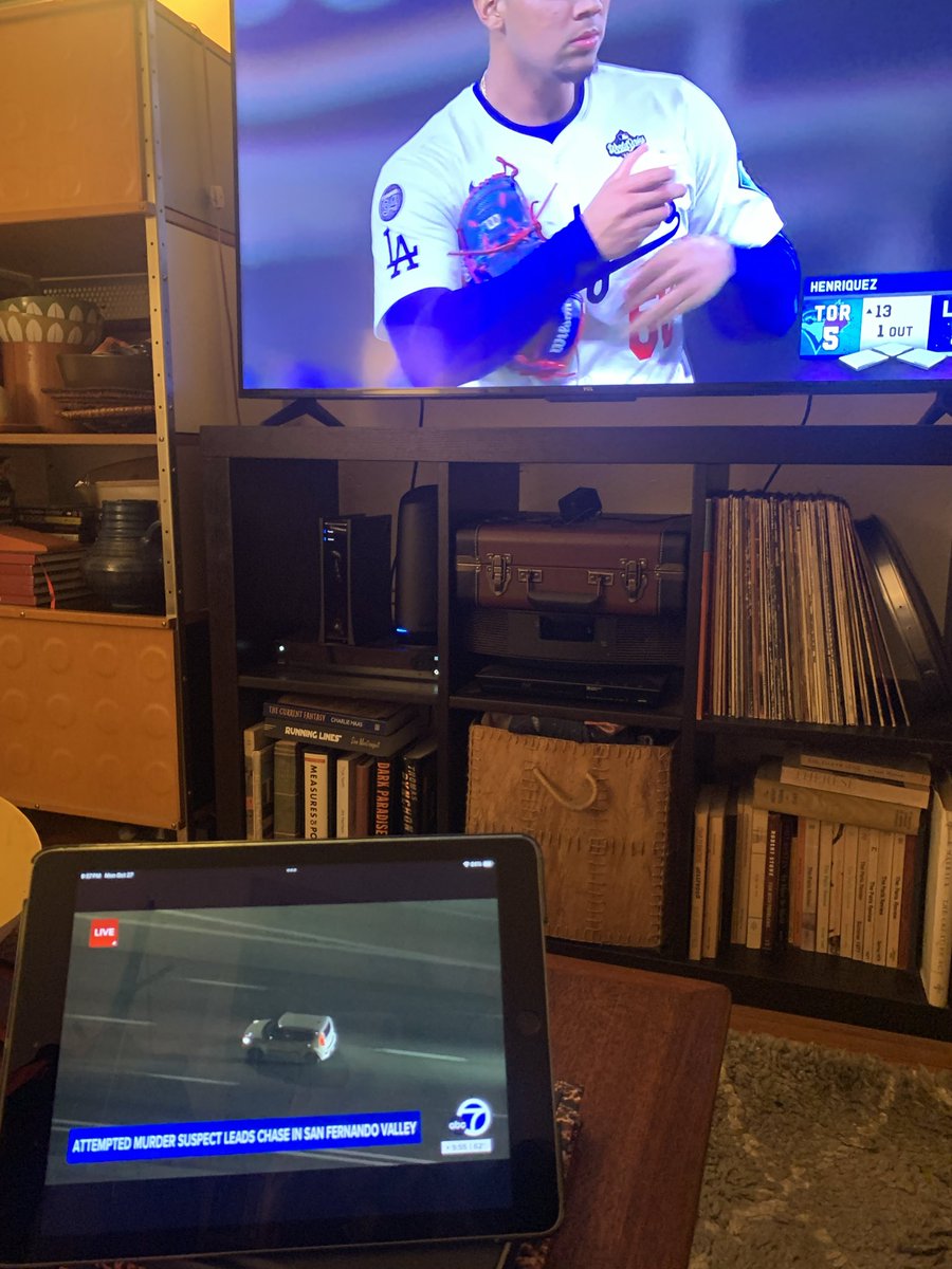 designomad's tweet photo. 13th inning and now a car chase. Multi tasking 💙 #goDodgers https://t.co/hCA6ooNDid