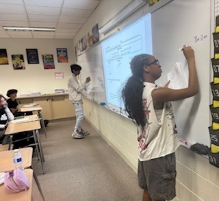 PHSCCADMIN's tweet image. Students in Mr. Arison’s geometry class working through review problems on the board for tomorrow’s test!