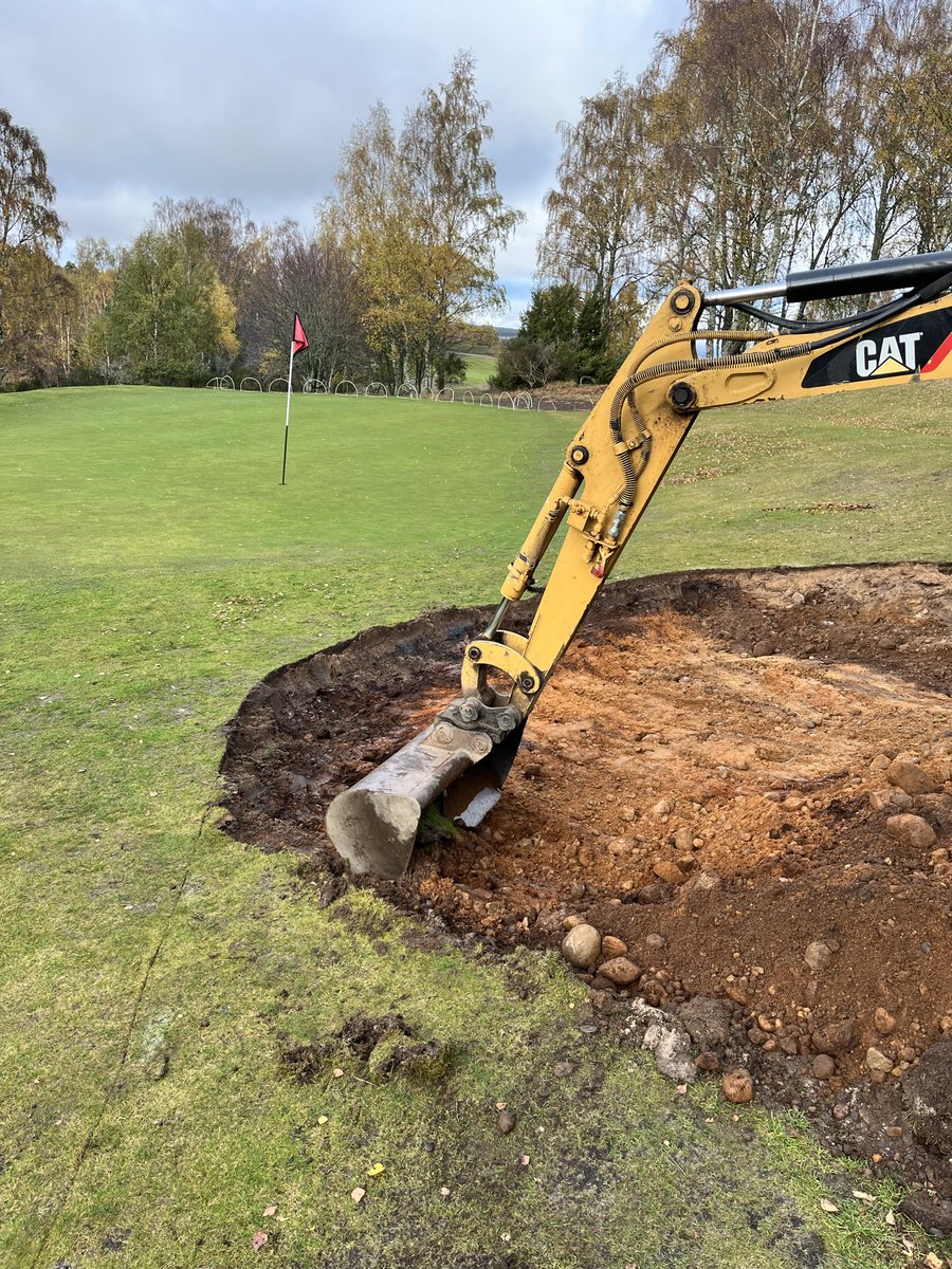 Digging out some of the aprons, rubbish underneath! No wonder we couldn’t get the grass growing