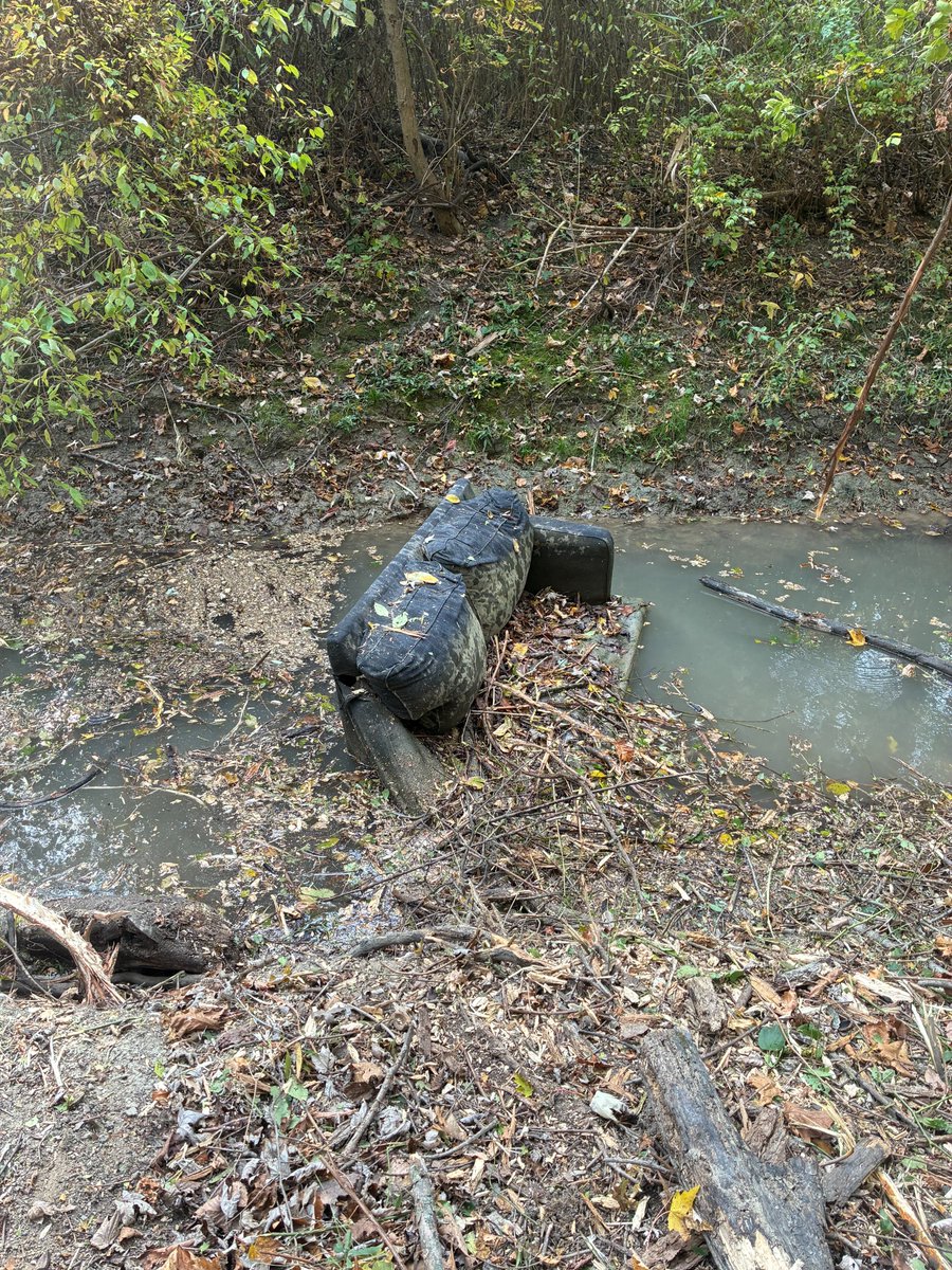 While removing branches and debris from the Fuller Drain near 21 Mile &amp; I-94 in Chesterfield Twp., our crew found this discarded couch. Dumping into streams &amp; other drains is illegal and impedes the flow of stormwater, which harms water quality &amp; increases the risk of flooding.