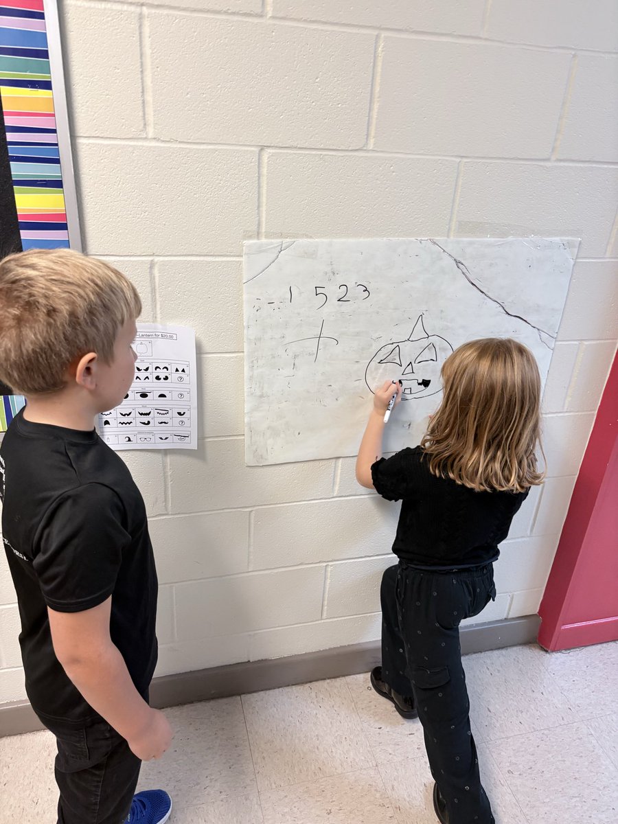 Grade 2 worked on a Building Thinking Classrooms challenge to design a jack-o’-lantern with a total cost of $20! Each pumpkin, eye, nose, mouth, and accessory had a different price, so groups had to plan, problem-solve, &amp; collaborate to create their perfect $20 jack-o’-lantern.