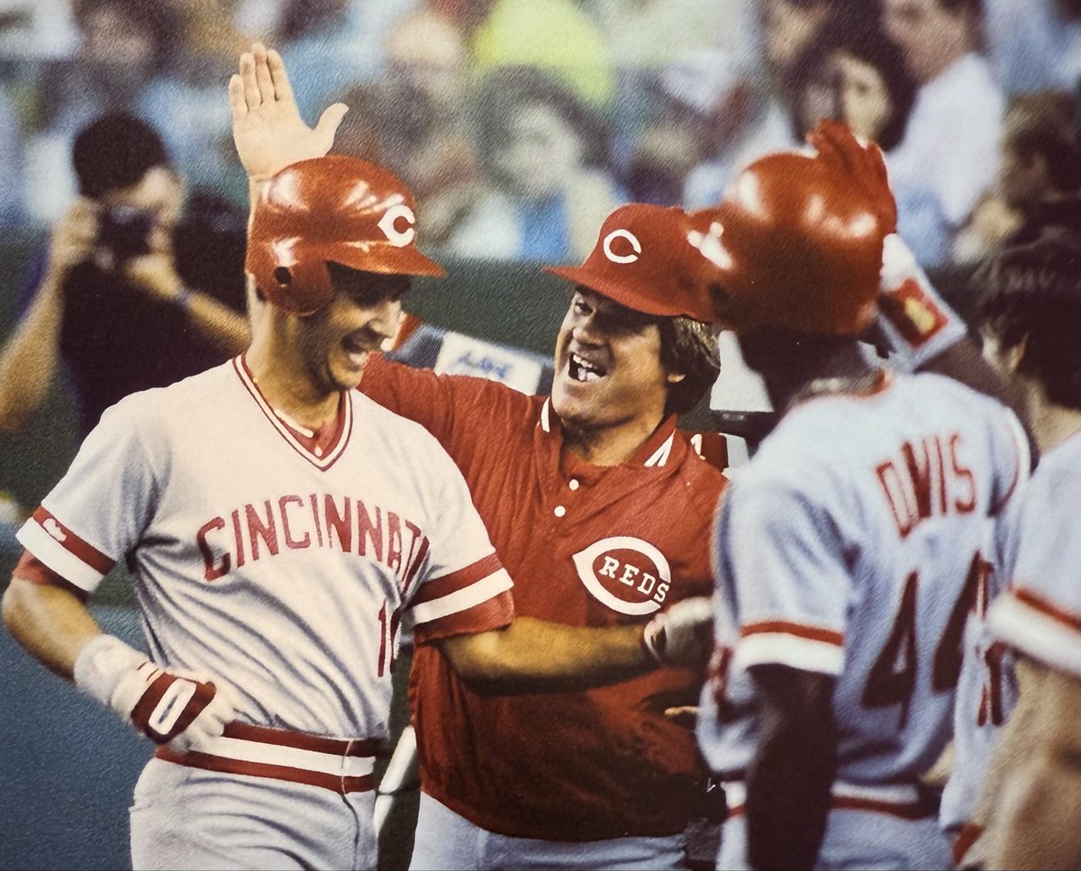 Pete Rose greets first baseman Terry Francona, in a 1987 game.