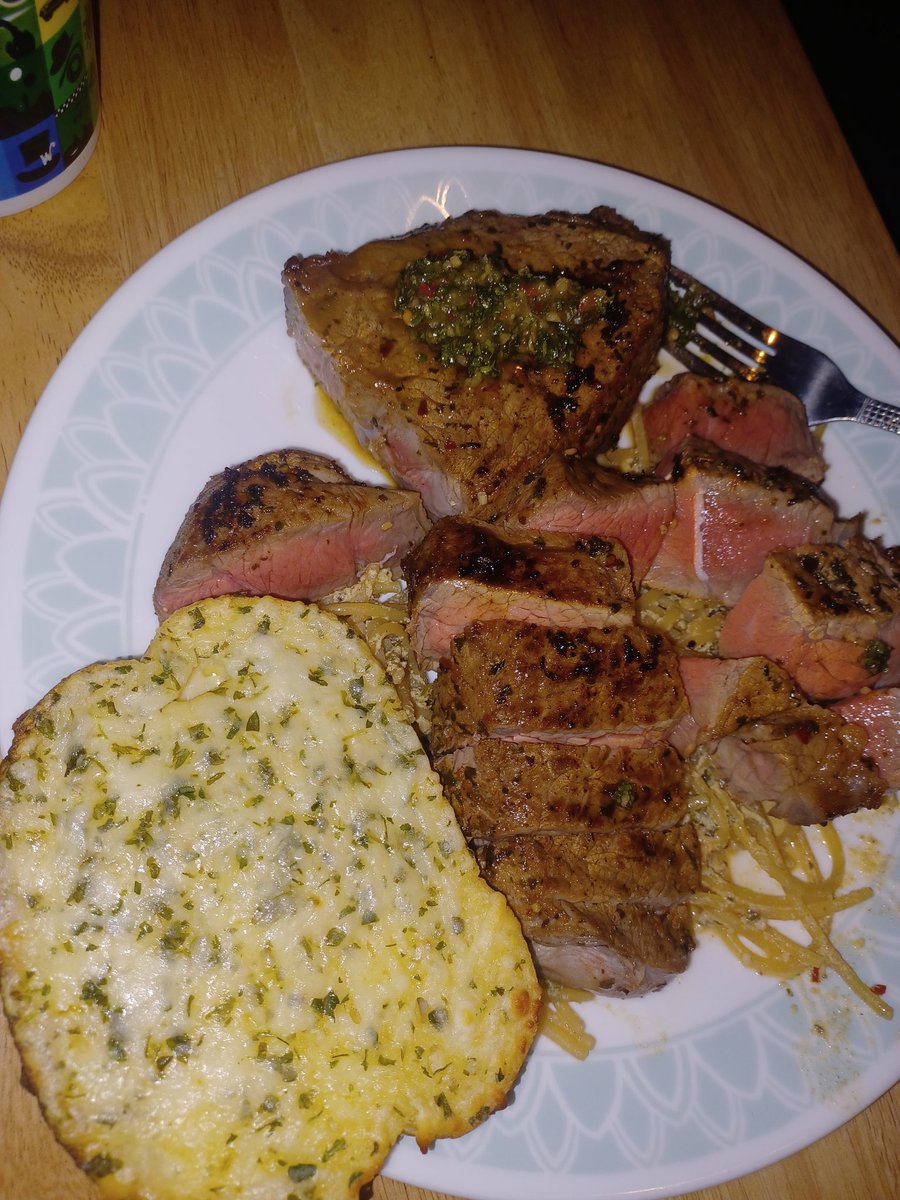 My birthday dinner. Steak marinated in a habenero chimmichurri. Atop carbanara with garlic bread