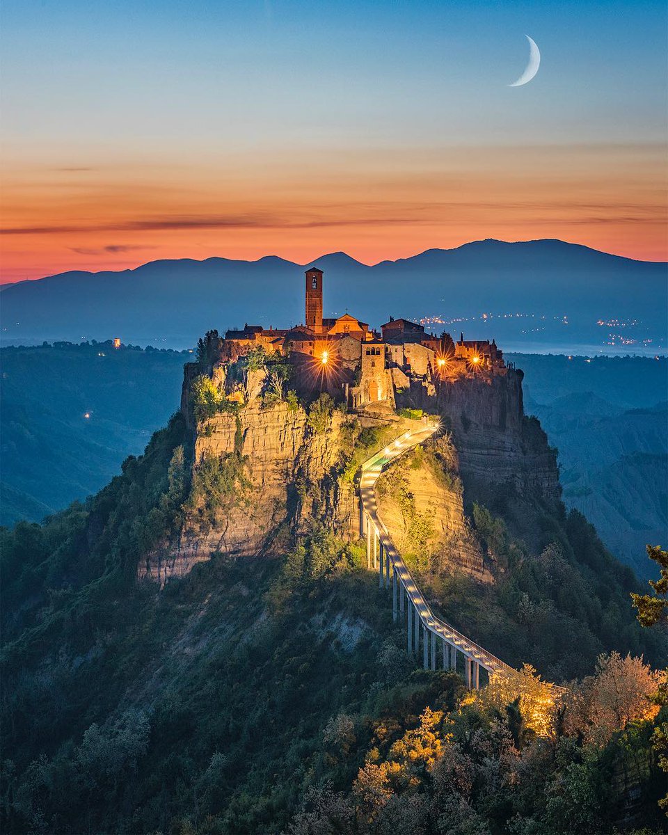 This isn't AI.

It's Civita di Bagnoregio, an Italian village.