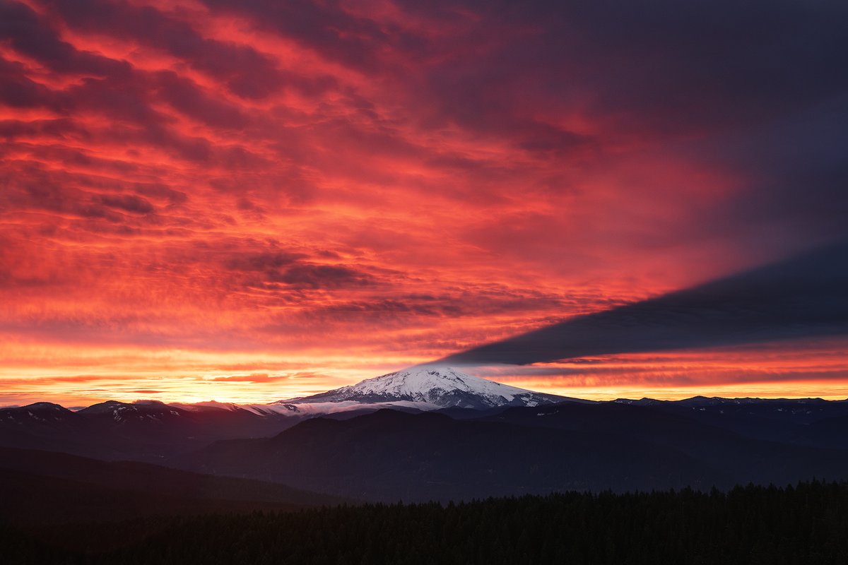 Incredible sunrise on Tuesday morning over Mt Hood as it cast its shadow on the midlevel cloud base from an approaching warm front #orwx