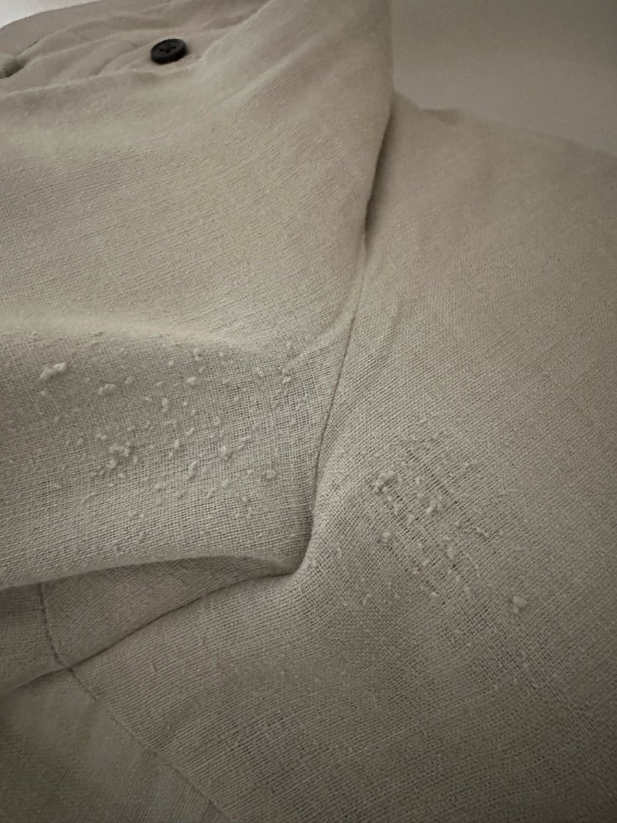 Anybody knows what is the reason for such a state of cloth under a crotch area in an expensive trouser.