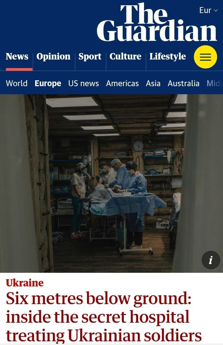 带有蓝色标题的卫报新闻文章网页的屏幕截图，包括新闻、观点、体育、文化、生活方式等部分以及欧洲、美国、美洲、亚洲、澳大利亚等世界地区。主要标题是“地下六米：在治疗乌克兰士兵的秘密医院内，伴随着医务人员穿着蓝色磨砂膏和口罩的图片，在配备设备和监视器的临床室内为一名被绿色窗帘覆盖的患者进行手术。