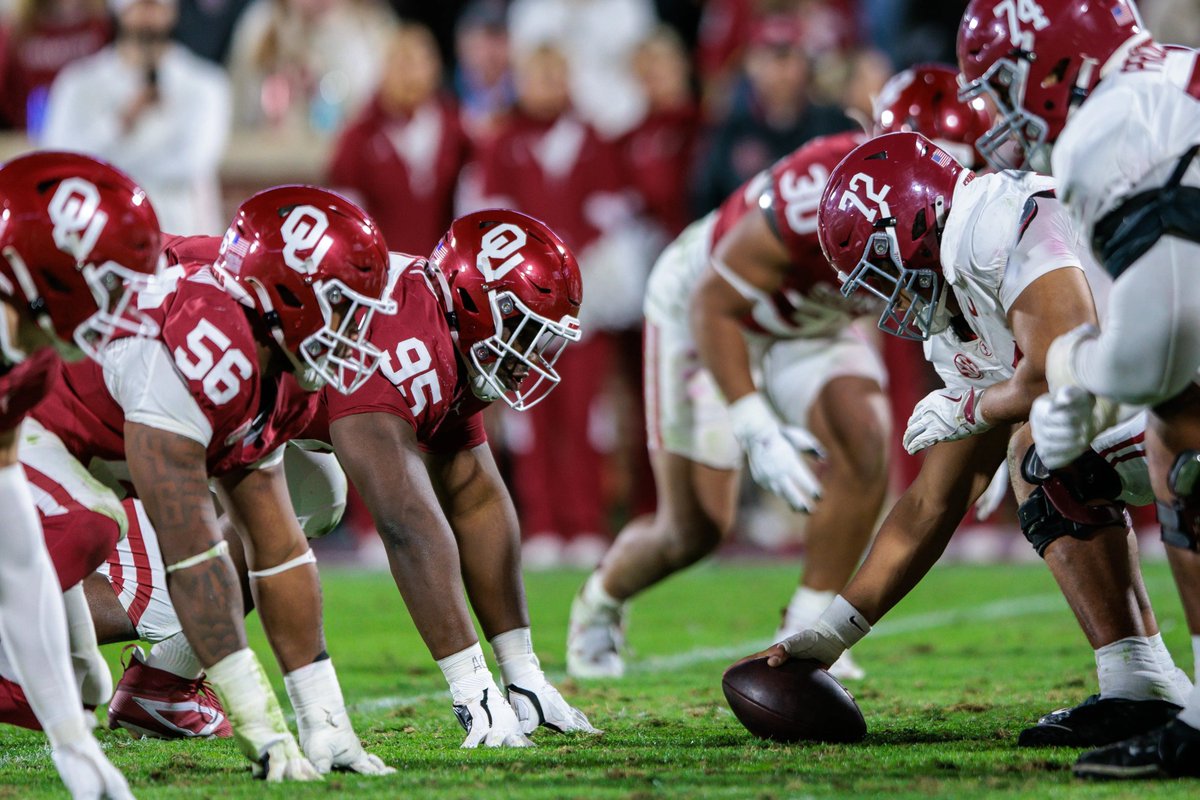 SoonerTracker's tweet photo. Despite using the same brand Pantone Color (201) the Sooners and Crimson Tide have very different football helmet finishes.

Alabama uses a standard gloss shell, while OU has used a metallic finish since 2000. https://t.co/yqNQxqu2CQ