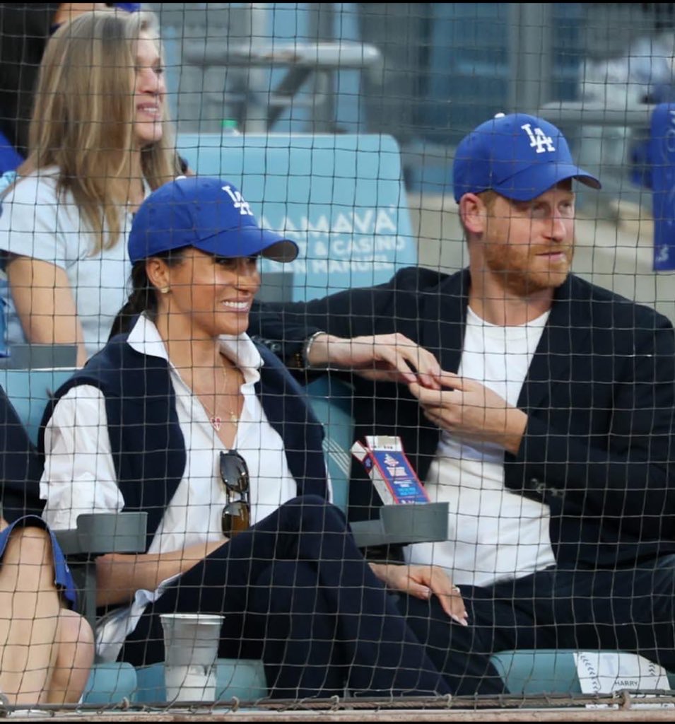 The craziest thing about this photo isn't that Harry and Meghan showed up to cheer for the Dodgers at the World Series game last night.

It's that his father is literally Canada's Head of State.