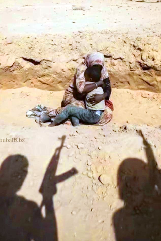 OunkaOnX's tweet photo. Moments before a mother and her child were executed by UAE-backed RSF militias in Sudan.

A genocide is unfolding in plain sight — the world cannot look away https://t.co/RHYdv8Aq1J