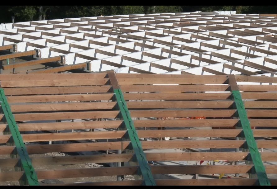 Sanaa structural logic. each beam tilted to follow the slope of the site and the distance between beams changing slightly.