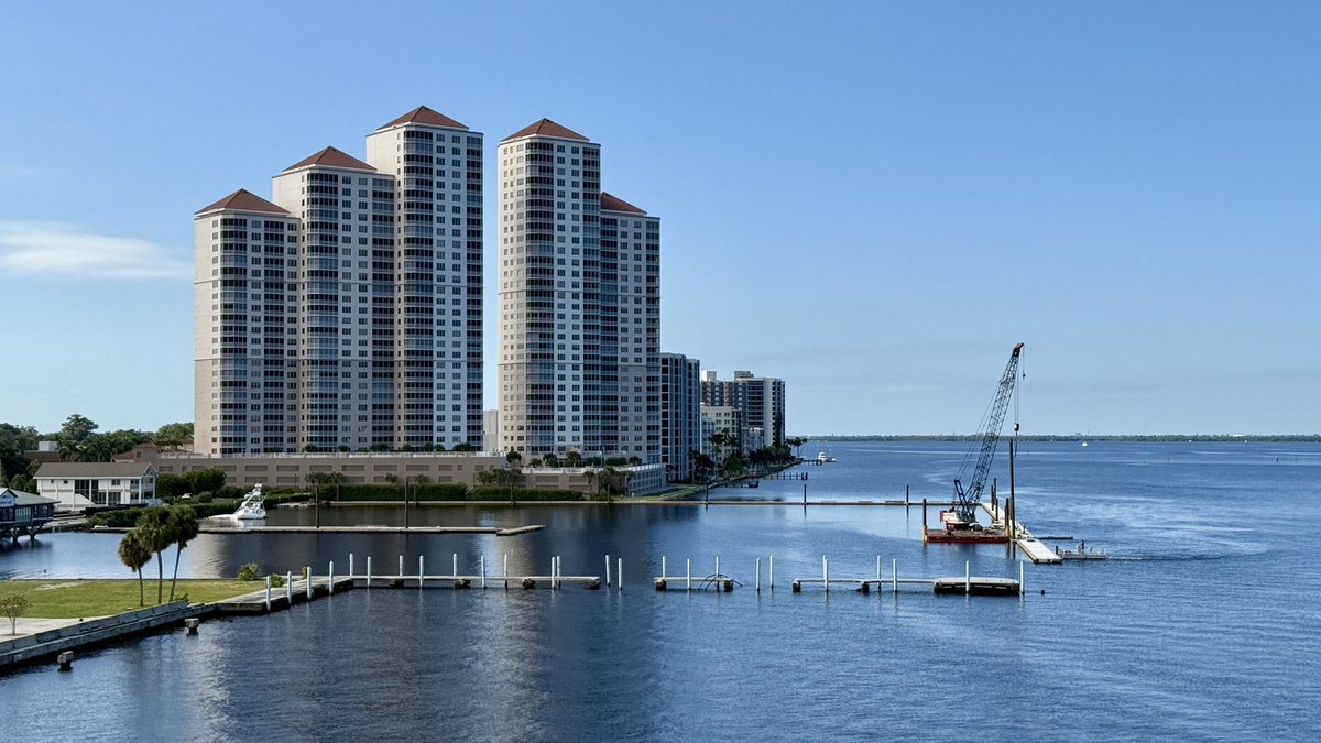 Workers are making good progress on Legacy Harbor in Fort Myers. If you look closely, a half sunken boat still remains more than 3 years after Hurricane Ian destroyed the marina here.