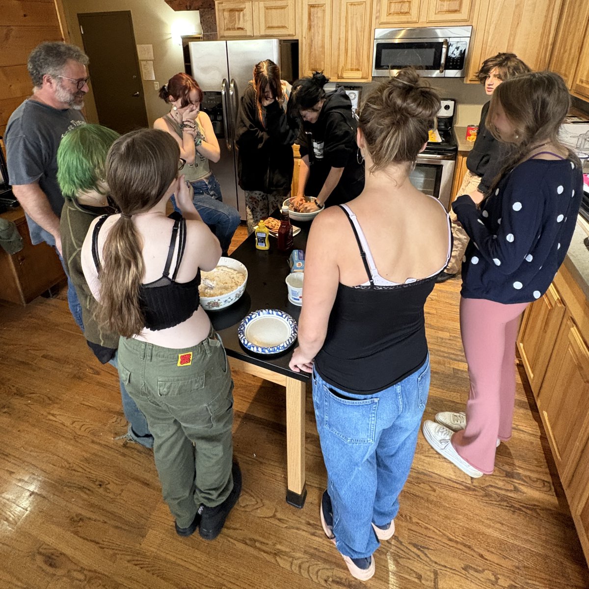CommunityHS's tweet image. Josh’s American history class took to the kitchen to recreate iconic dishes from the 1950’s pop culture. They made and sampled simple Velveta cheese and crackers, Spam fiesta peach cups, ambrosia, and a jello mold - all while music from the era played in the background.