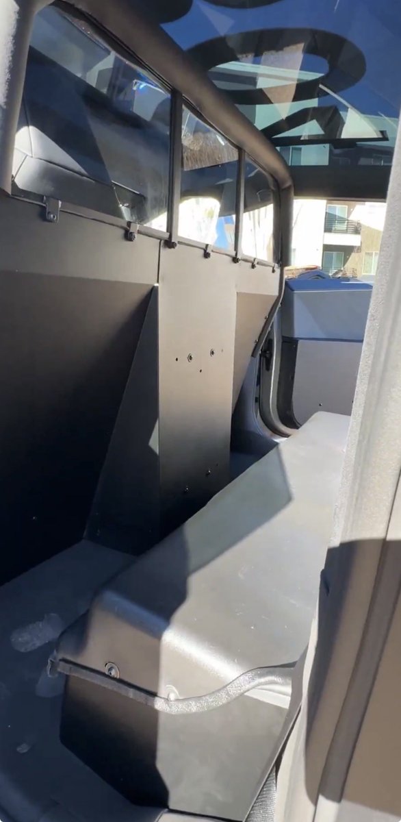 Here’s what the front and back seat areas look like in a Cybertruck Police patrol vehicle.