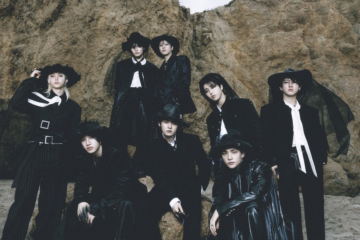 Under the muted tones of the earth and sea, 𝗲𝗶𝗴𝗵𝘁 figures stand and draped in black, where velvet meets shadow. The wide-brimmed hats, the tailored lines, the dark silk that moves like waves—all whisper the same story: mystery, poise, and a touch of 𝙧𝙚𝙗𝙚𝙡𝙡𝙞𝙤𝙣.