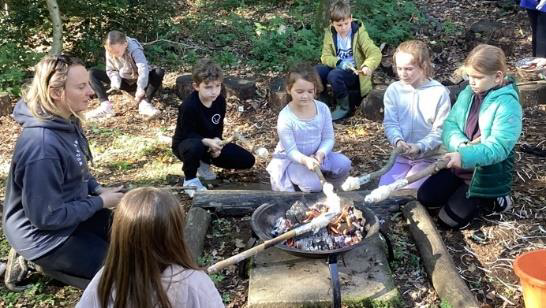 Dovery_Academy's tweet photo. Year 4 recently wrapped up their Forest School sessions with the traditional marshmallow toasting around the campfire, while Year 2 began theirs last week on a very rainy Monday - embracing the outdoors whatever the weather! https://t.co/rsfBAMO9Mr
