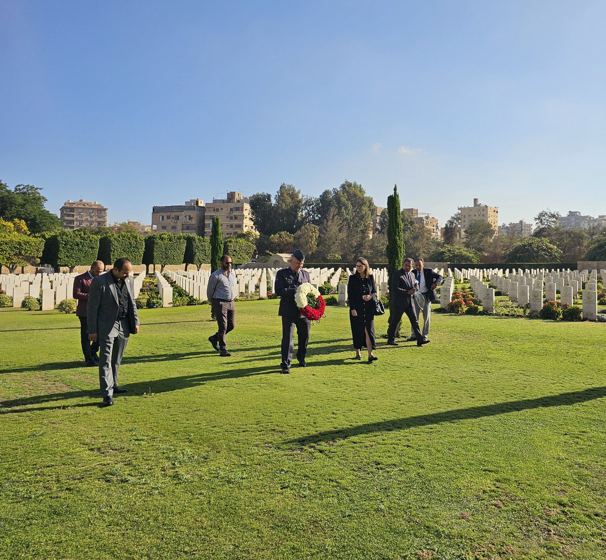 KHALELAWAJA's tweet photo. The Polish Ambassador in Egypt paying respects to the fallen at Heliopolis War Cemetery.@AAPAComms @CWGC @SiJFletch @Ahmed_AAalSayed https://t.co/Wp6l0TtQBk