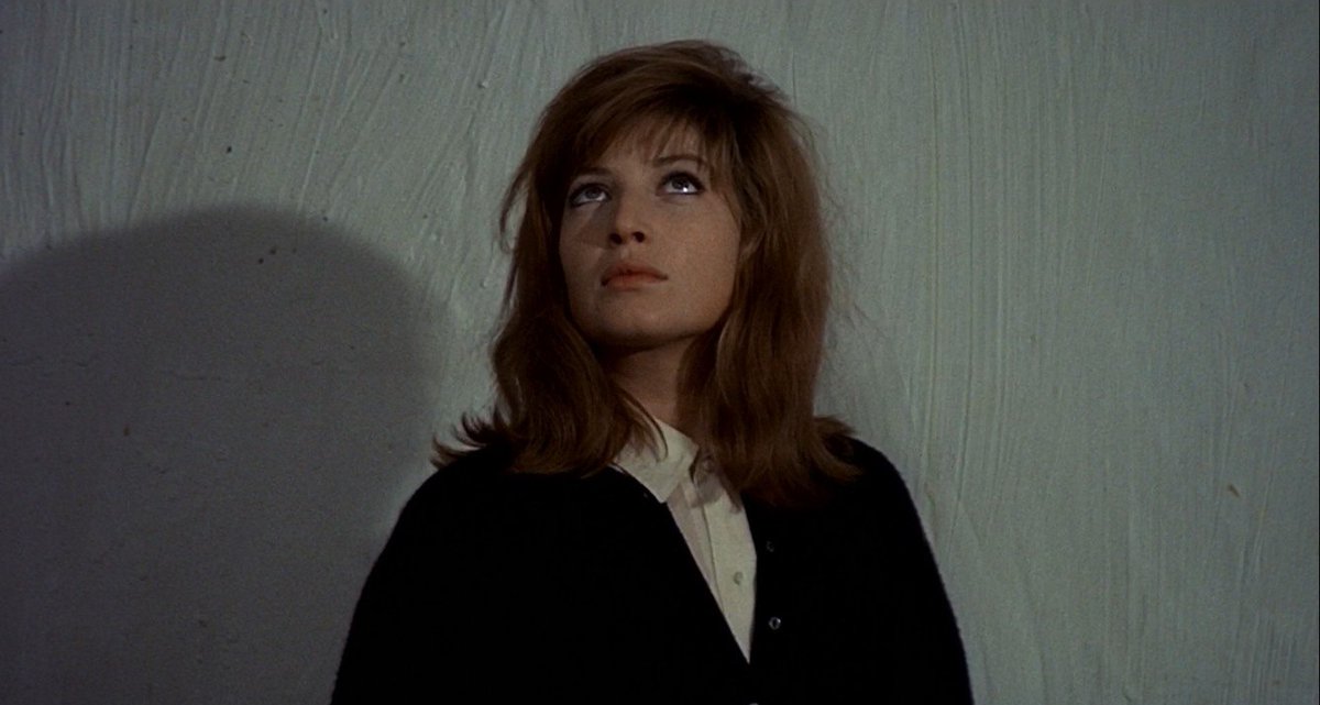 LewisBeerBlog's tweet image. Monica Vitti, alone with her shadow and a blank wall, looks at her surroundings with wry disappointment. Earlier, Giuliana pictured blue walls and a green ceiling, but now the swirling white void seems more apt. Though not literally red, it is one manifestation of the red desert.