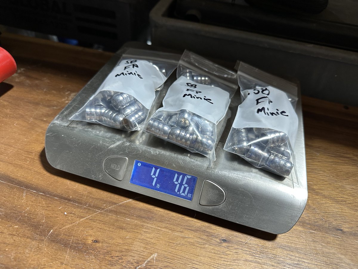 Gmfh_mod's tweet photo. These are .58 caliber 495 grain flat point pure lead Minié balls. 60 of them. Thats 4 lbs of lead. War winner there next to them for scale.
They are a little tricky to pour, but they load easy, shoot great and hit meat like they were purpose built to fuck shit up…. Because they were. 
I ordered this mold for me, to use with my .58 great plains hawken. I added them to the website as a bullet for sale in case a fellow sophisticate wanted a straight meat hammer without the hassle. 
Got the first order for them out today. That is a masculine chunk of lead. Handsome and deadly. Not effeminate like those dainty .264’s 😂. My testosterone is getting tested tomorrow, and I’m sure it’s a few points higher having just laid eyes on these.