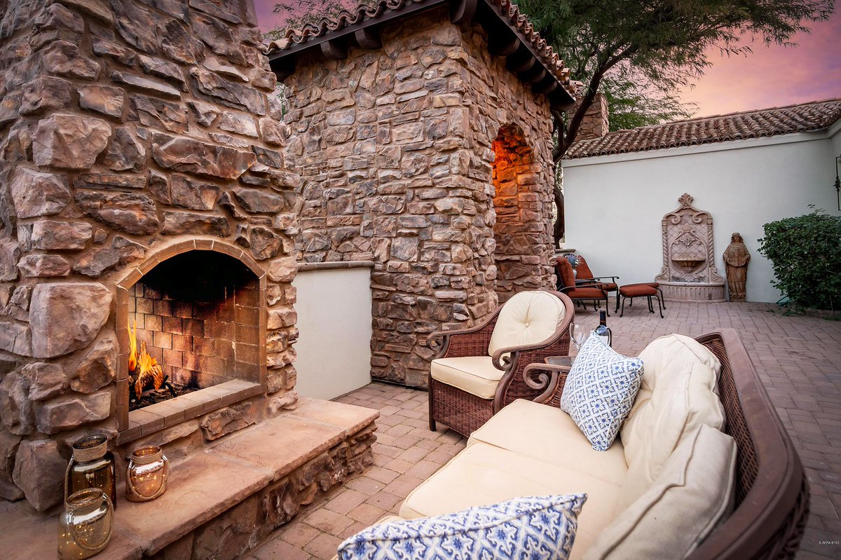 It's fireplace season! This beautiful space was created with Coronado Stone Products Italian Villa / Dakota Brown. #design #style #outdoorliving #fireplaces #coronadostone coronado.com