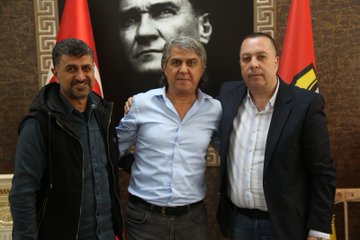 First image shows two men in suits signing documents on a table with pens, surrounded by Turkish and yellow-black club flags, a large portrait of Mustafa Kemal Atatürk on the wall, decorative flowers, and ornate wooden elements in a formal room. Second image depicts a man in light blue shirt and gray pants signing a document on a table, with Turkish and club flags, Atatürk portrait, and similar decor. Third image features three men posing together, one in dark hoodie and vest, one in light blue shirt, and one in suit, standing arm-in-arm in front of Atatürk portrait and flags in the same ornate room setting.