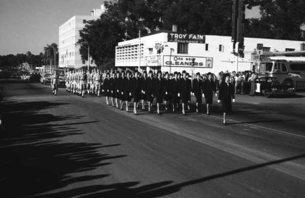 StateLibraryFL's tweet image. #VeteransDay in pictures from our collection (@FLMemory): A women’s military reserve group marching in a parade in Tallahassee; six views of camp life at Tyndall Field; Governor Dan McCarty inspecting a military group; and the 1st Armored Rifle Battalion, 124th Infantry.