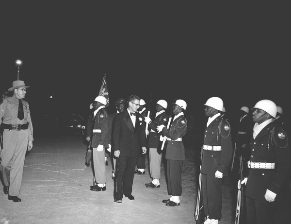 StateLibraryFL's tweet image. #VeteransDay in pictures from our collection (@FLMemory): A women’s military reserve group marching in a parade in Tallahassee; six views of camp life at Tyndall Field; Governor Dan McCarty inspecting a military group; and the 1st Armored Rifle Battalion, 124th Infantry.