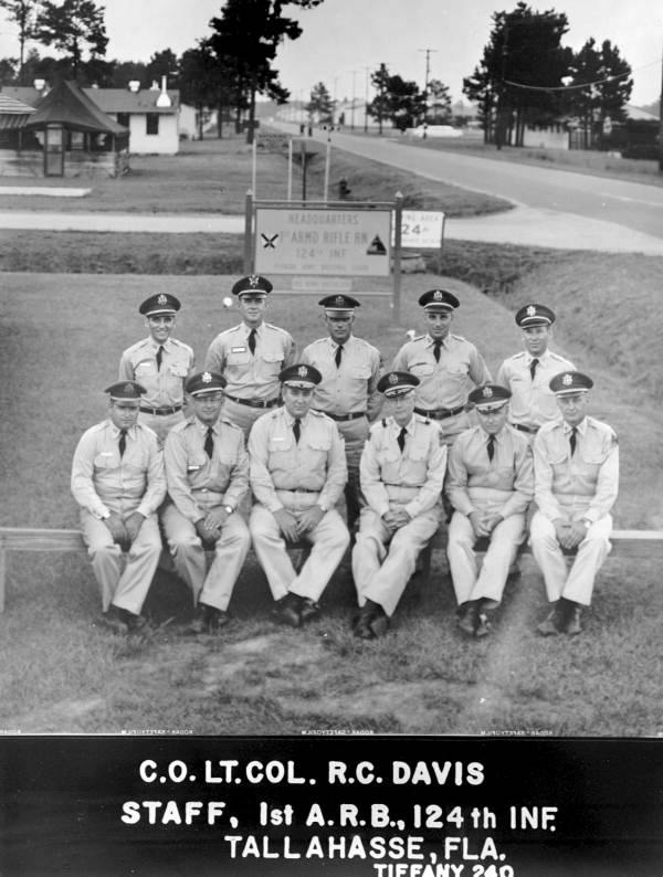 StateLibraryFL's tweet image. #VeteransDay in pictures from our collection (@FLMemory): A women’s military reserve group marching in a parade in Tallahassee; six views of camp life at Tyndall Field; Governor Dan McCarty inspecting a military group; and the 1st Armored Rifle Battalion, 124th Infantry.