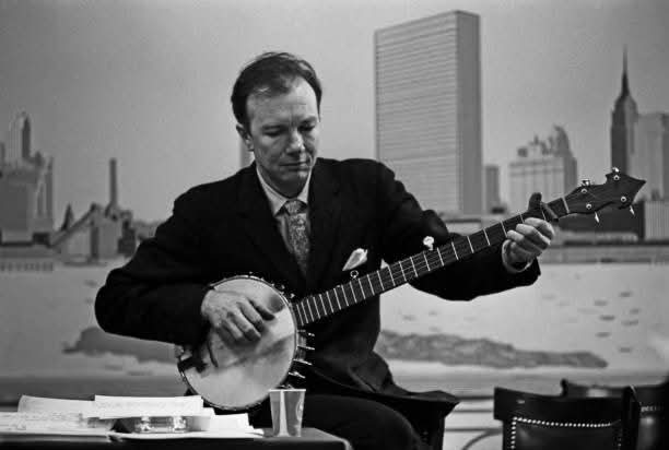 You may be cool. But you will never be Pete Seeger in a suit playing long neck banjo against the New York skyline cool.