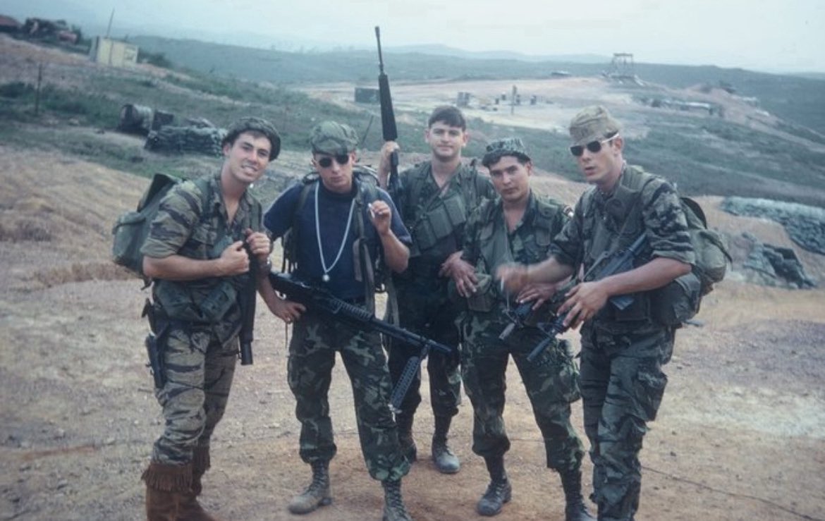 Courtesy of our guest today, Larry Chambers- 
“How I spent Christmas at Camp Eagle: This is my not so typical team preparing to leave on a different type of LRP mis-sion. Our job was to keep the Bob Hope USO show safe from sneak attack. Larry is  smiling, standing next to
