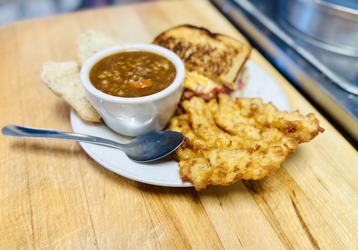 Ah, comfort food done right.  Nothing beats kicking off with a steaming hot cup of beef barley soup that hits you with that instant warm fuzzy feeling deep down. Then bam, a fresh-out-the-grill potato pancake, made from scratch and dangling off your plate like it's too cool to