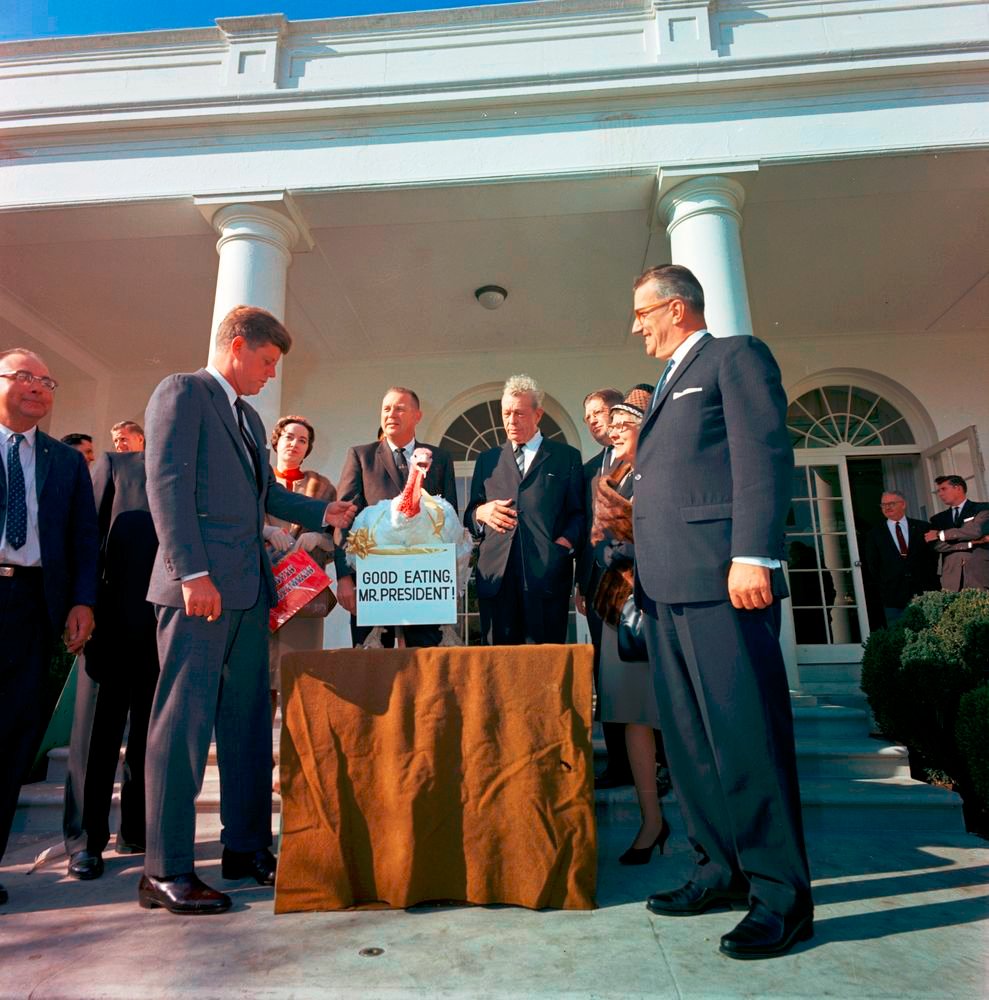 At the annual White House Turkey Presentation, President Kennedy surprisingly breaks with tradition, sending the turkey back to the farm rather than having it for Thanksgiving dinner. Newsmen joke that Kennedy has "pardoned" the turkey and suggest that a new tradition has begun.