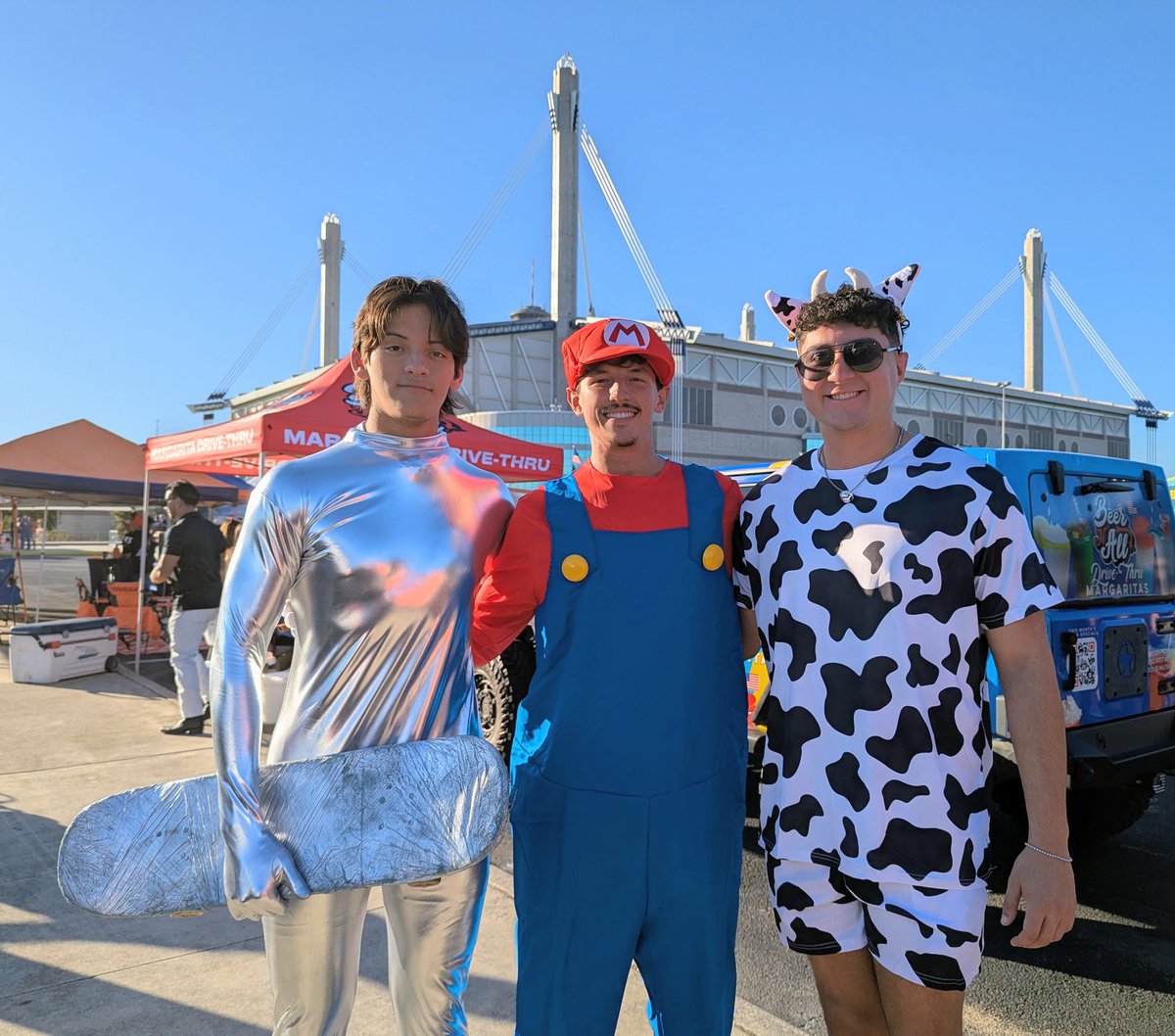 UTSA's tweet image. Mario, the Silver Surfer and a cow go to the Alamodome. We, uh, haven't figured out the punchline yet, but we know they're rooting for the Roadrunners. 🤙🎃

@UTSAFTBL #Halloween2025 #UTSA #UTSanAntonio #GoRunners