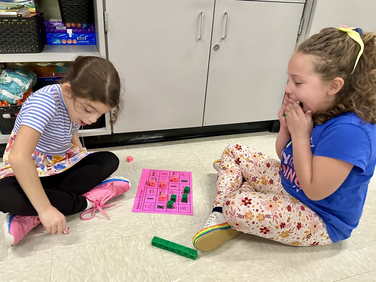 ngriffith106's tweet photo. I’m not sure who loves math games more, me or them??? Look how intently they are playing and learning at the same time…this makes my ❤️ happy. https://t.co/bTi8idgxKE