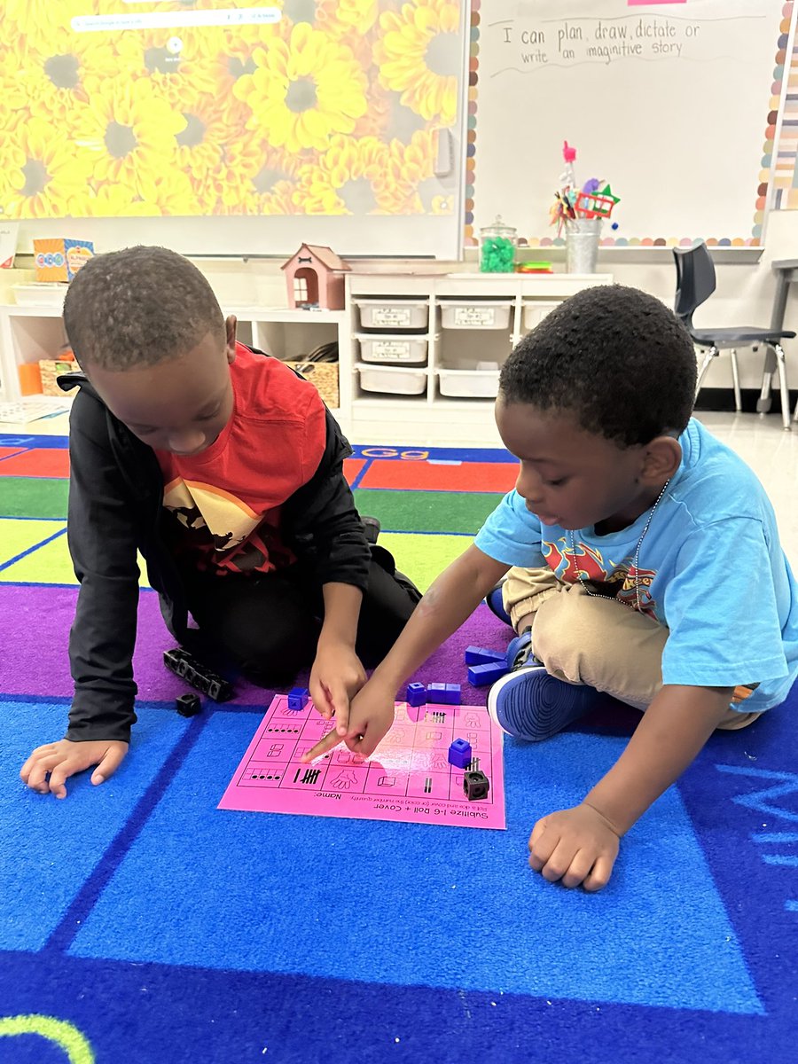 ngriffith106's tweet photo. I’m not sure who loves math games more, me or them??? Look how intently they are playing and learning at the same time…this makes my ❤️ happy. https://t.co/bTi8idgxKE