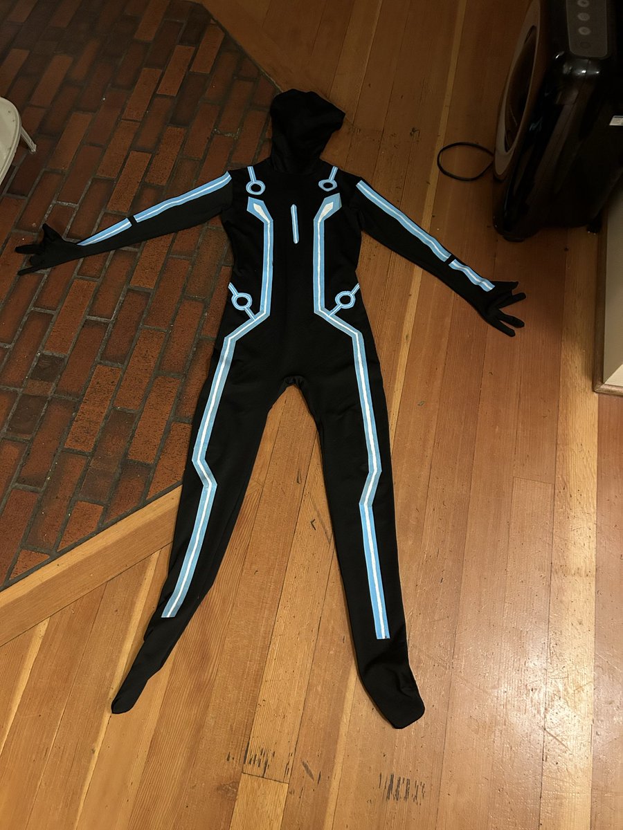 Made a Tron costume for the kid I work with And it fell apart after he put it on so I spent 2 hours hot gluing duct tape to him while he wore the bodysuit