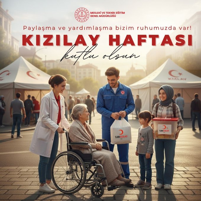 A group of people stands in an outdoor setting with white tents displaying the Turkish flag emblem. A man in a blue worker uniform holds a red aid box labeled with a crescent moon logo. Nearby, a woman in a white lab coat assists an elderly woman seated in a wheelchair wearing a shawl. Two young children, one boy and one girl in casual clothes, hold similar red aid boxes. Another woman in a headscarf and long dress stands smiling. In the background, more people in modest attire gather, with Turkish flags visible on tents and a building with the organizations Turkish name in red lettering.