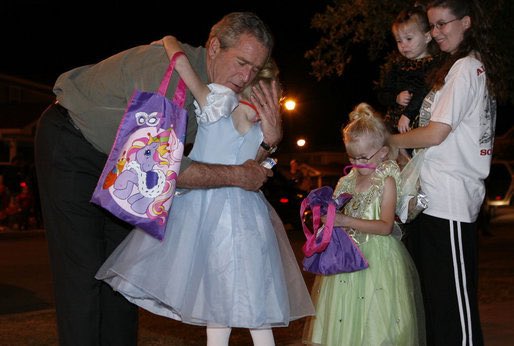 (1) George H.W Bush during Halloween, 1988
(2) George W. Bush during Halloween, 2006