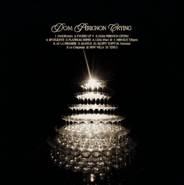 Dimly lit ruined grand hall interior with ornate columns, a large crystal chandelier hanging from the ceiling, debris scattered on the floor, and soft light filtering through windows. Stacked champagne glasses forming a tall tower under bright spotlights, with text overlay reading Dom Perignon Crying, listing tracks like 4 Spots La Panorame 9 Mots Il A Trop Bu and locations like Le Crepuscule New York Times. Profile of a person wearing sunglasses and earrings, face partially obscured by light and shadow.