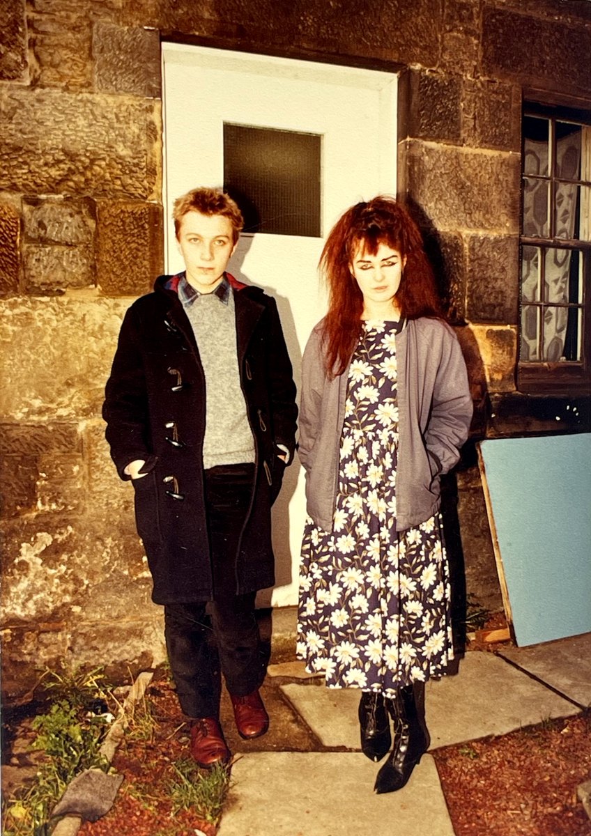 Strawberry Switchblade's Jill Bryson &amp; Stephen McRobbie of <a href="/pastels_the/">the pastels</a>. Taken by Peter McArthur, Jill's partner &amp; prime photographer of the early 1980s Glasgow indie scene. They look bored as it's just Peter testing camera flashes. Outside Peter &amp; Jill's flat, around 1982.
