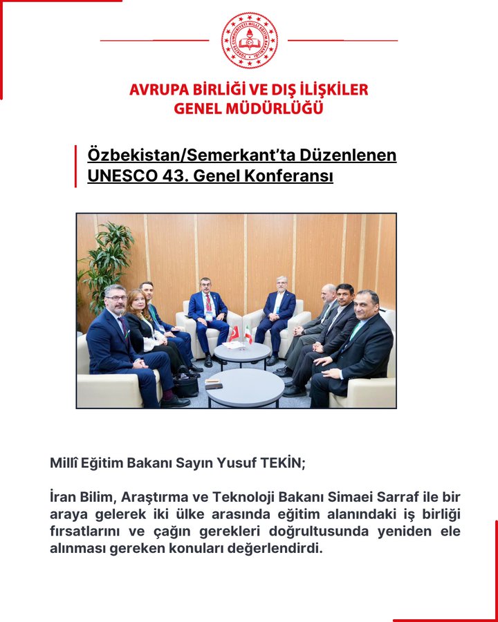 Group of men in suits seated around a round table in a modern conference room with wooden walls and a green plant in the background discussing at the UNESCO 43rd General Conference in Samarkand Uzbekistan featuring Turkish Minister Yusuf Tekin and Iranian Minister Simaei Sarraf with Turkish ministry logo at top.