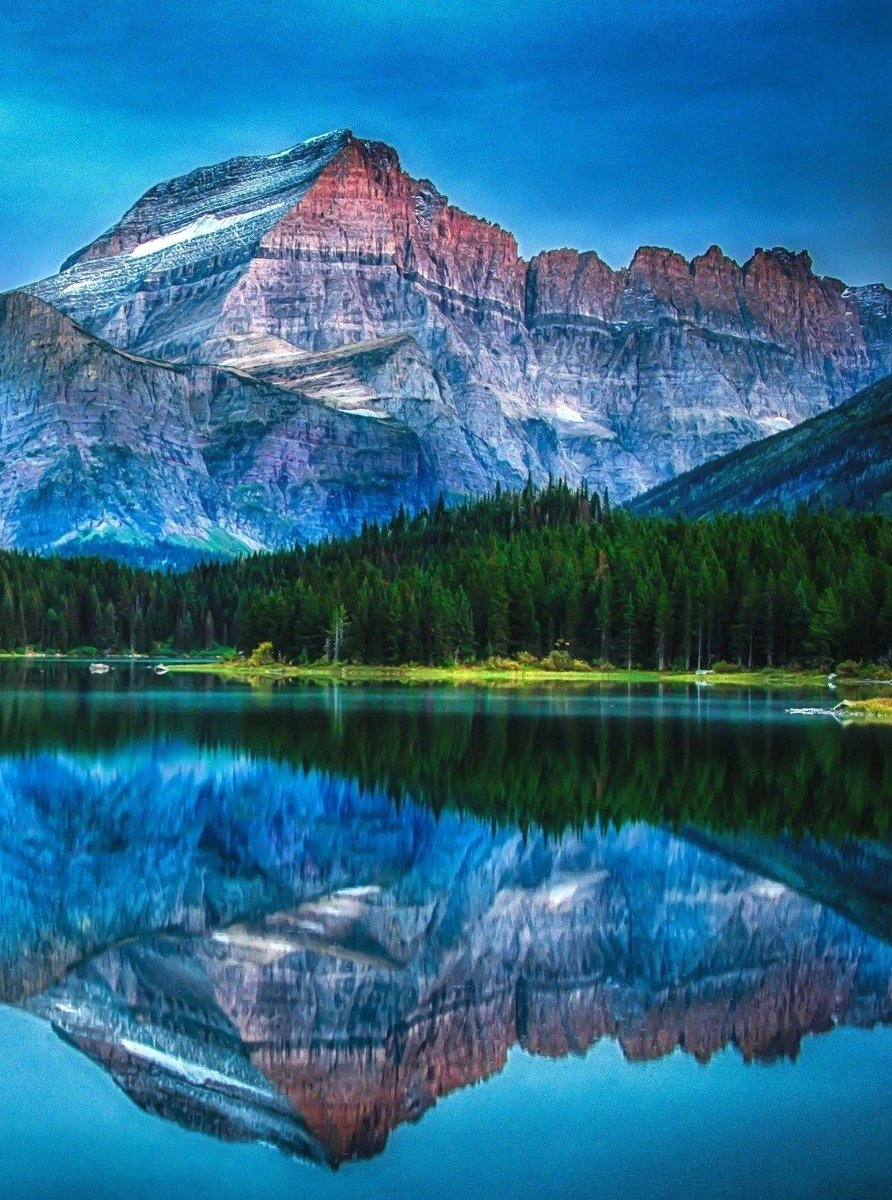 Beautiful day to see Bearhat Mountain's perfect reflection on a serene lake in Glacier National Park in northwestern Montana, US  🇺🇸