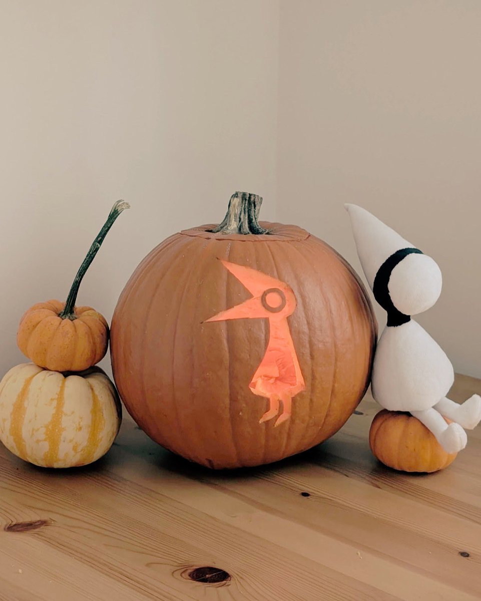 A picture of pumpkin, with a carved image of a Crow from the Monument Valley game series.