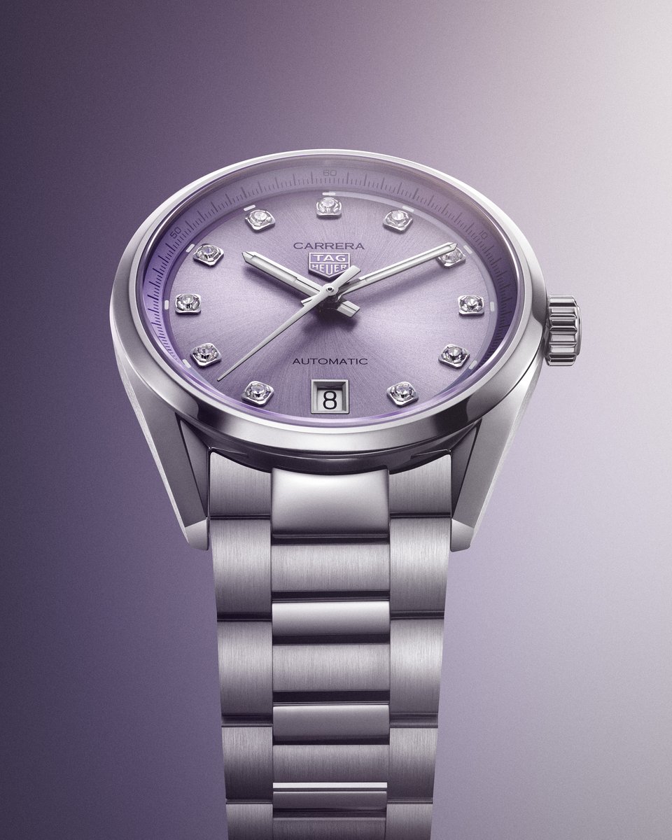 TAGHeuer's tweet image. The TAG Heuer Carrera Date, presented in a pastel-hued lilac, brings a fresh and sophisticated touch to the Carrera collection, infusing it with a renewed sense of elegance. Its snail-brushed dial is adorned with 11 diamonds that catch the light with subtle brilliance, drawing…