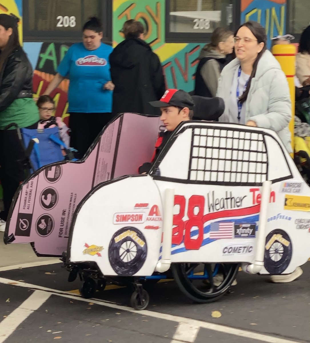 CheriannM's tweet photo. Mikey was a mini @shanevg97 for Halloween. My amazing friends made this for his wheelchair. We watch the races every week and he wanted to be SVG 👻🎃 https://t.co/EzXMssYl9x
