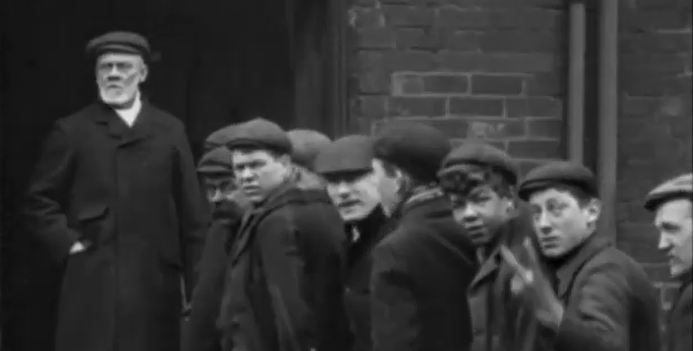 qikipedia's tweet photo. The first visual evidence of the V-sign as a rude gesture is a 1901 film where a factory worker gives two fingers to the cameraman to show that he didn’t like being filmed. https://t.co/gtnx67WWpS