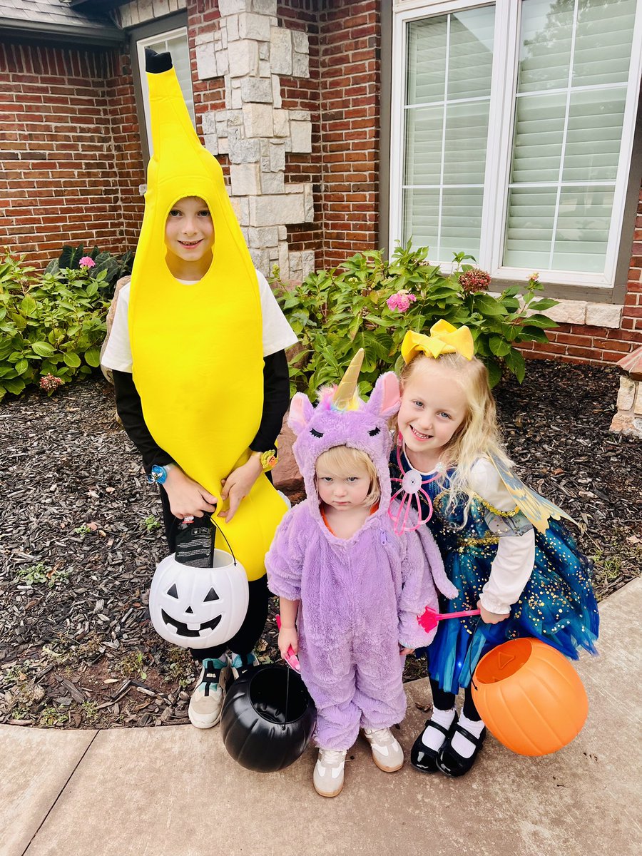 2 of the 3 are ready to get some candy…. The other is not so sure about this and is planning her revenge for making her wear a costume