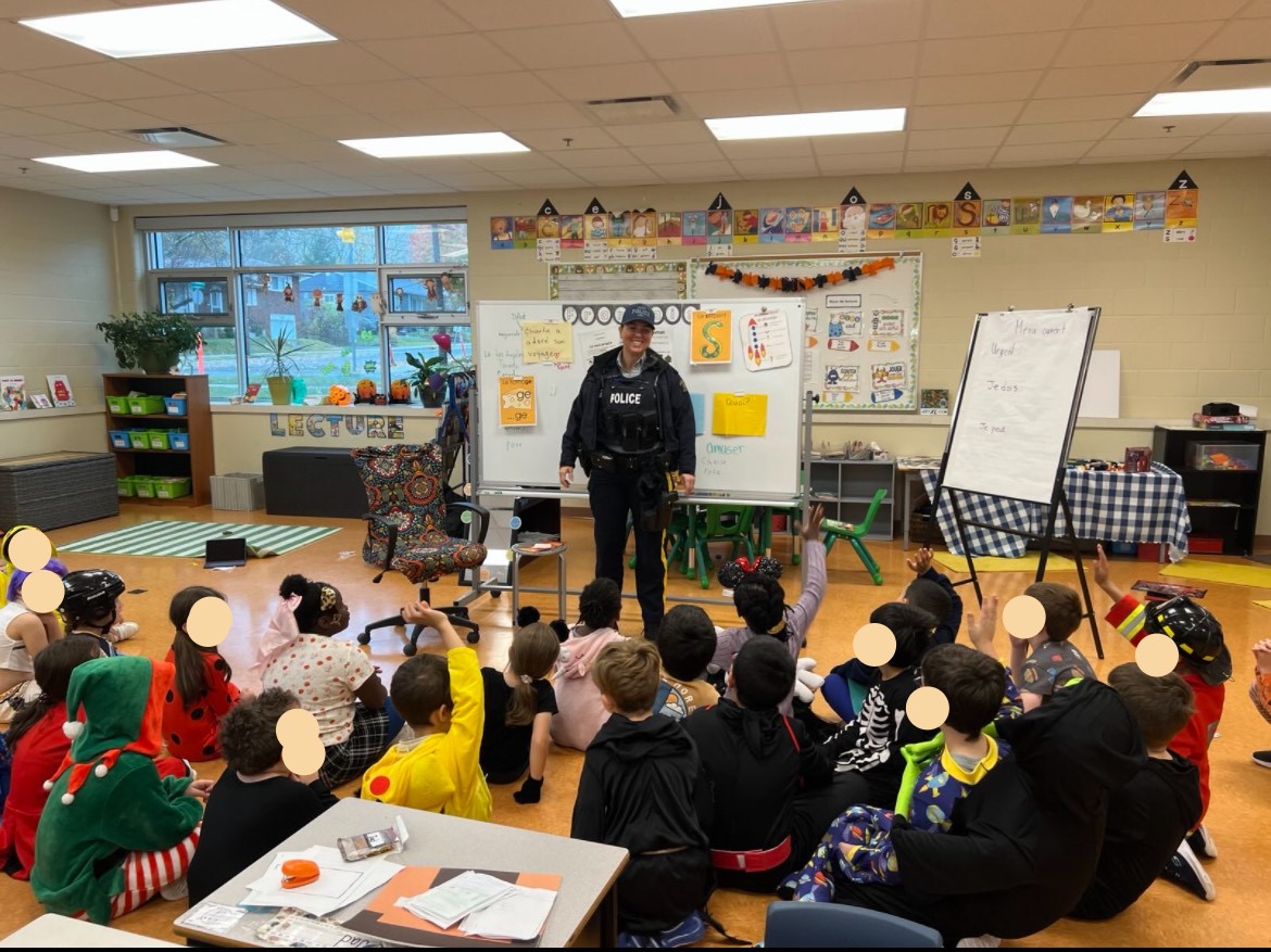 RCMPNB's tweet photo. Cst. Wood of the #Codiac Regional #RCMP visited Edith Cavell School and École Sainte-Bernadette this morning and spoke to students and staff about Halloween Safety. The students were very attentive and asked some great questions! Happy, safe Halloween! https://t.co/KeE9VK7ac5