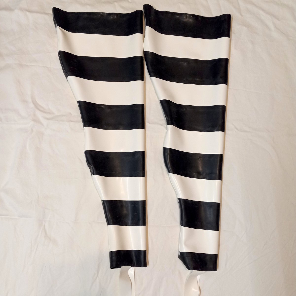 Happy Halloween!  These striped stockings were a custom order.  Contact me about a custom latex creation for yourself!  NimuesLatex.com

#latexfashion #Halloween2025